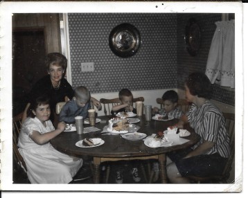 Me in the white dress, my mom behind me, my sister to the right and her 3 boys. 1963